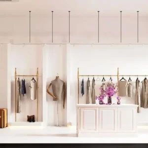 Boutique minimaliste effet béton beige avec mobilier velours cognac et touches dorées