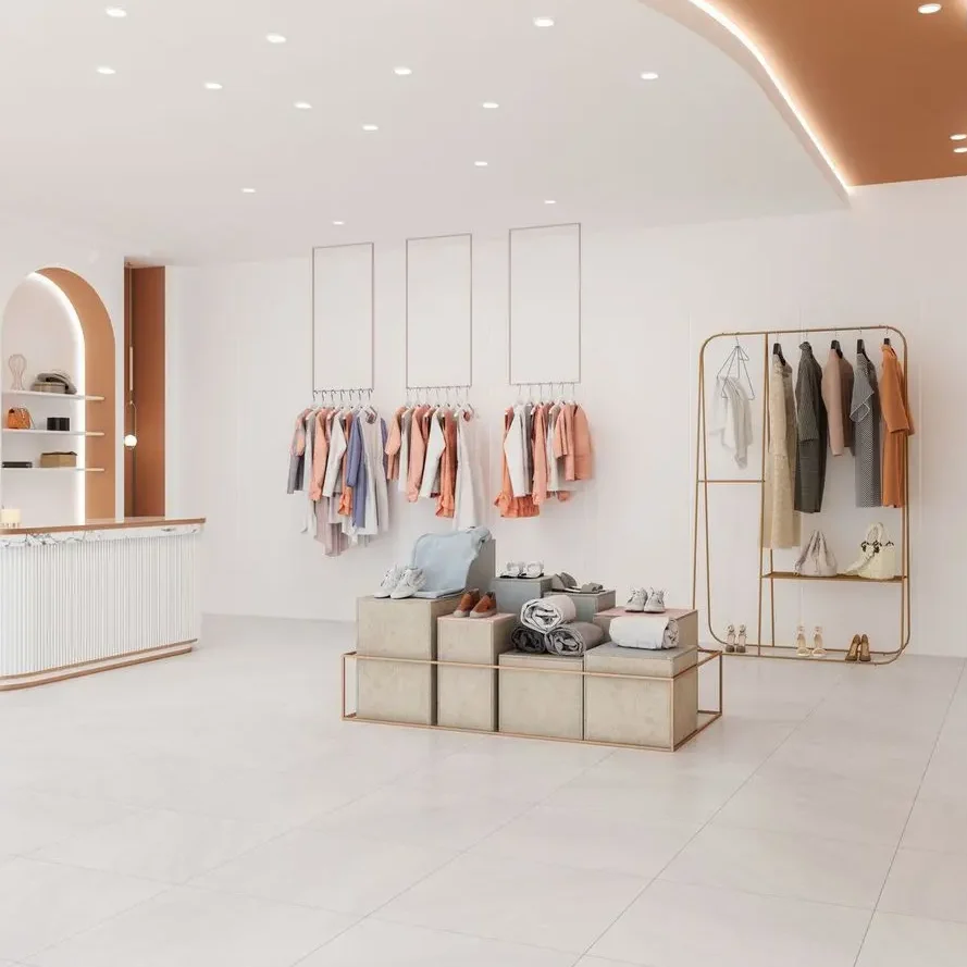 Boutique contemporaine avec comptoir cannelé, niches murales cuivre et éclairage architectural